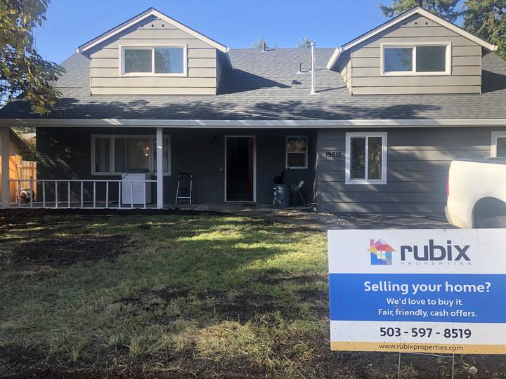 Rubix Properties yard sign in front of a purchased house